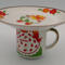 This is a view from the side showing the design on the plate and mug.